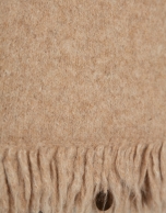 Jersey oversize beige con flecos
