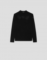 Jersey canalé punto fino negro con flores de encaje bordadas