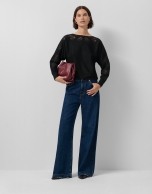 Black fine knit sweater with embroidered lace flowers on the sleeves