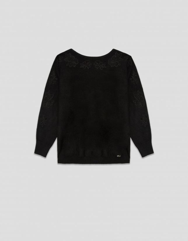 Black fine knit sweater with embroidered lace flowers on the sleeves