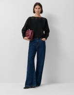 Black fine knit sweater with embroidered lace flowers on the sleeves