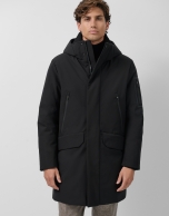 Long black quilted technical trench coat