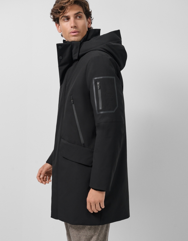 Long black quilted technical trench coat