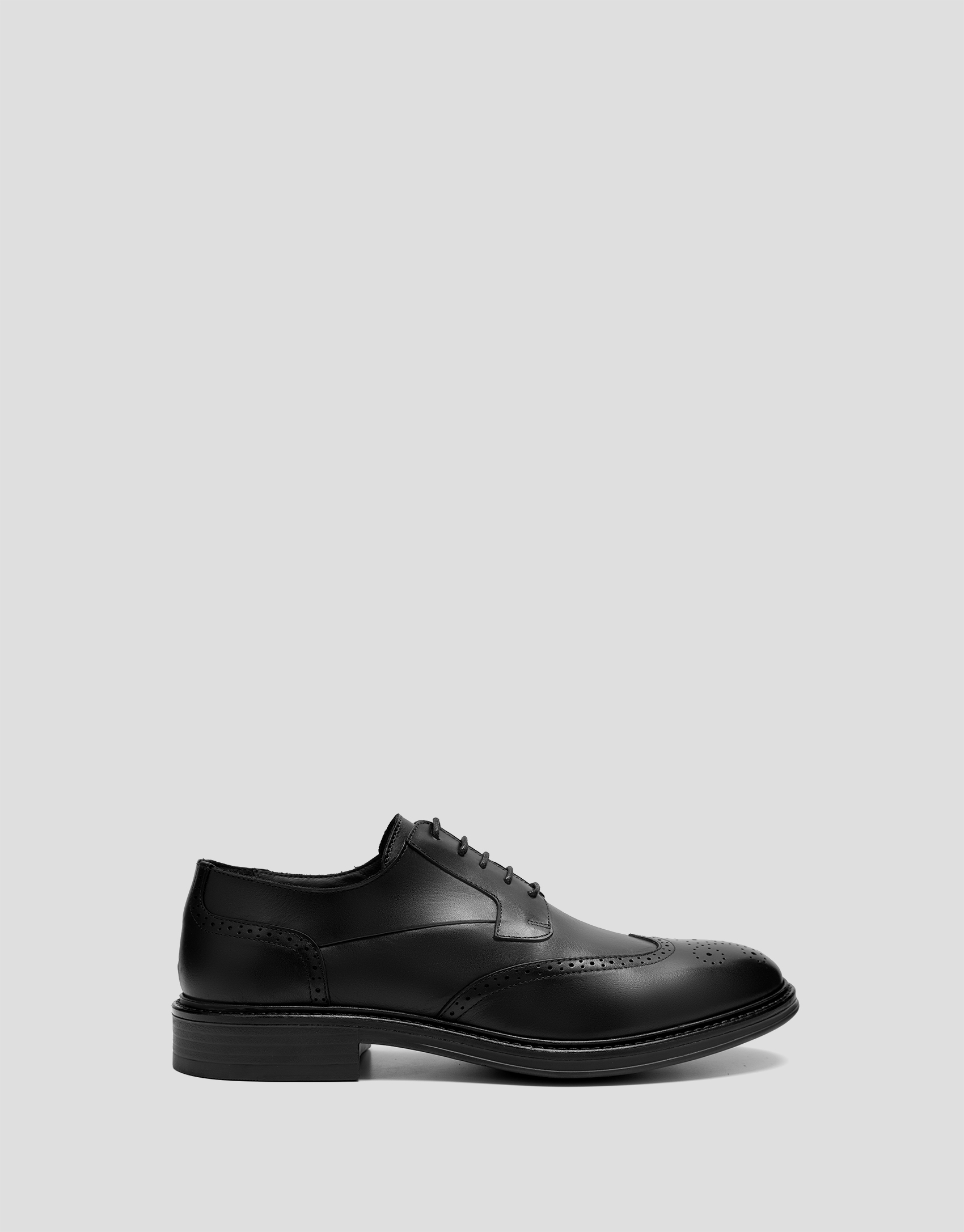 Black leather blucher-style brogue shoes