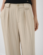 Beige pleated trousers with black pinstripes