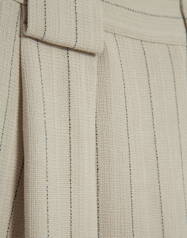 Beige pleated trousers with black pinstripes