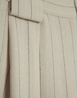 Beige pleated trousers with black pinstripe