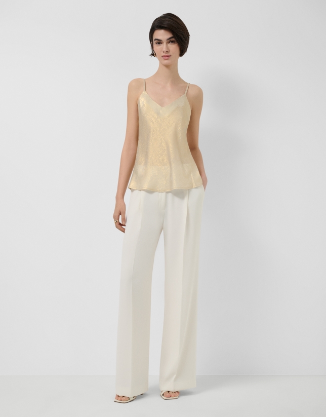 Sleeveless top in gold glitter laminated fabric