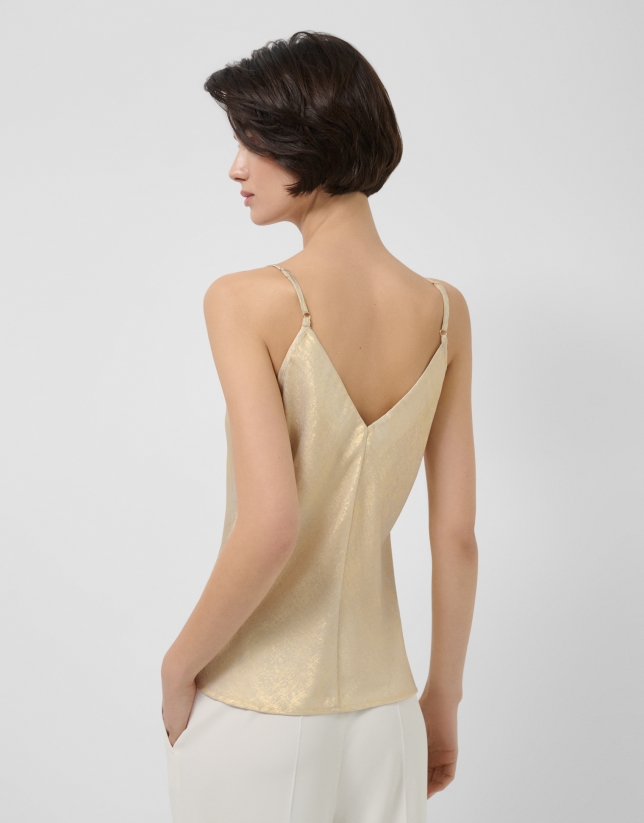 Sleeveless top in gold glitter laminated fabric