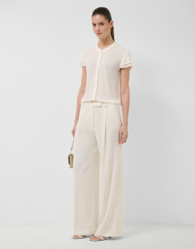 Ecru short-sleeved blouse with ruffles