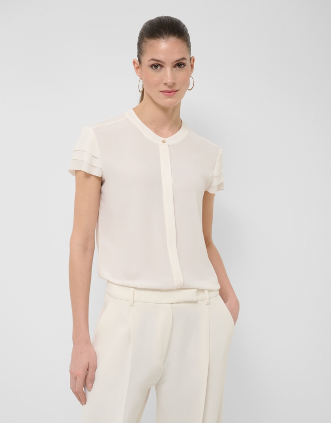 Ecru short-sleeved blouse with ruffles