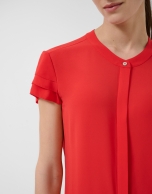 Red short-sleeved blouse with ruffles