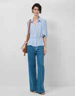 Light blue ruffled sleeve blouse with gathered waist