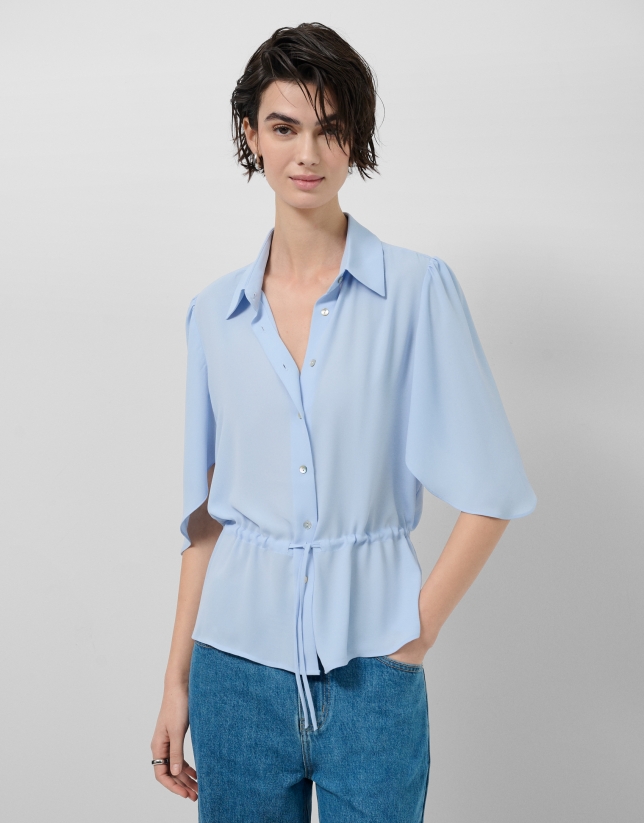 Light blue ruffled sleeve blouse with gathered waist