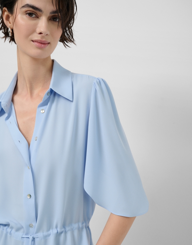 Light blue ruffled sleeve blouse with gathered waist