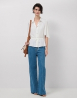 Ecru ruffle sleeve blouse with gathered waist