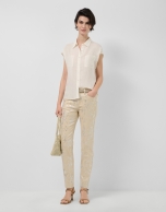 Ecru sleeveless blouse with pockets