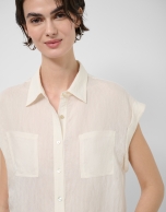 Ecru sleeveless blouse with pockets