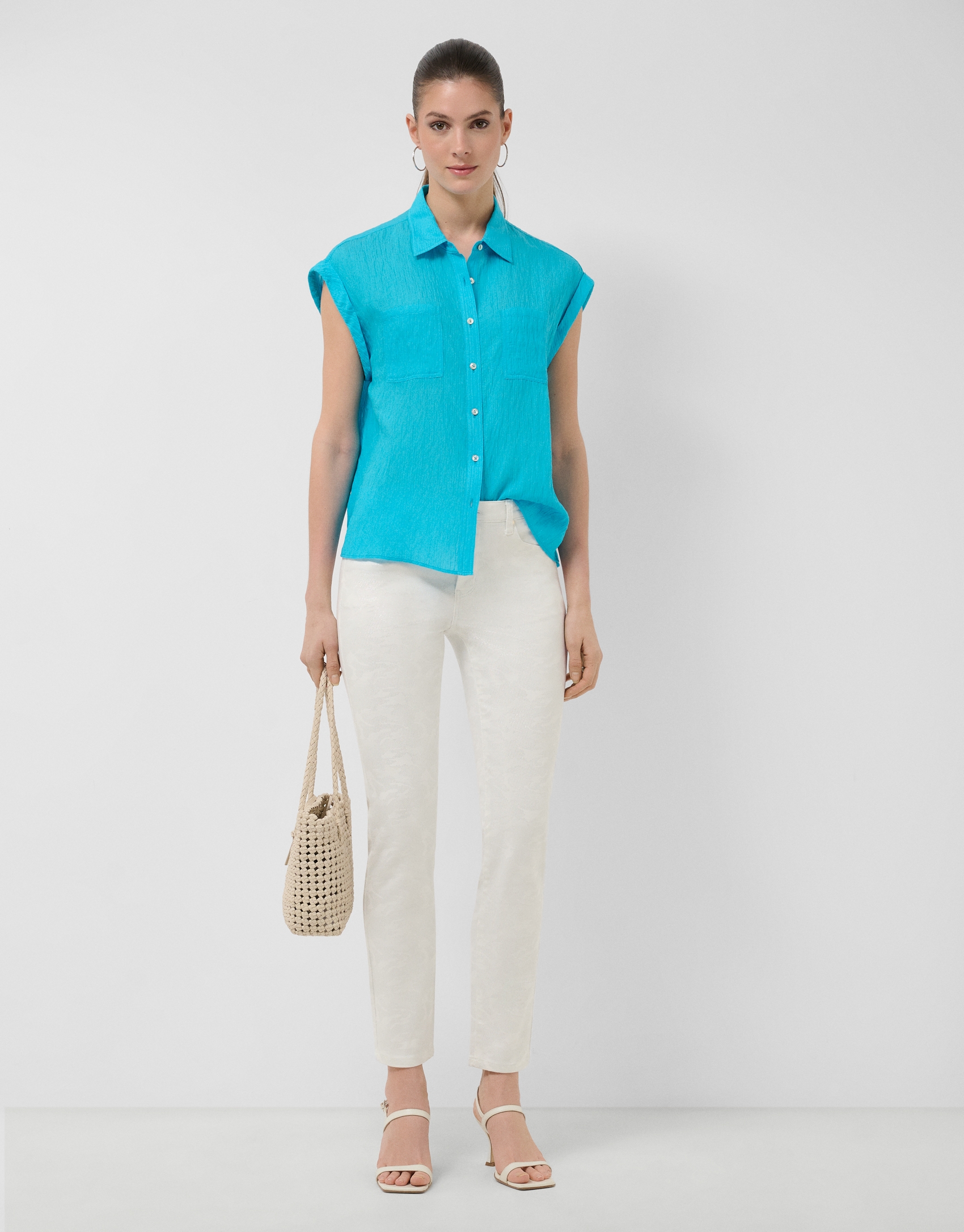 Turquoise sleeveless blouse with pockets