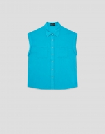 Turquoise sleeveless blouse with pockets
