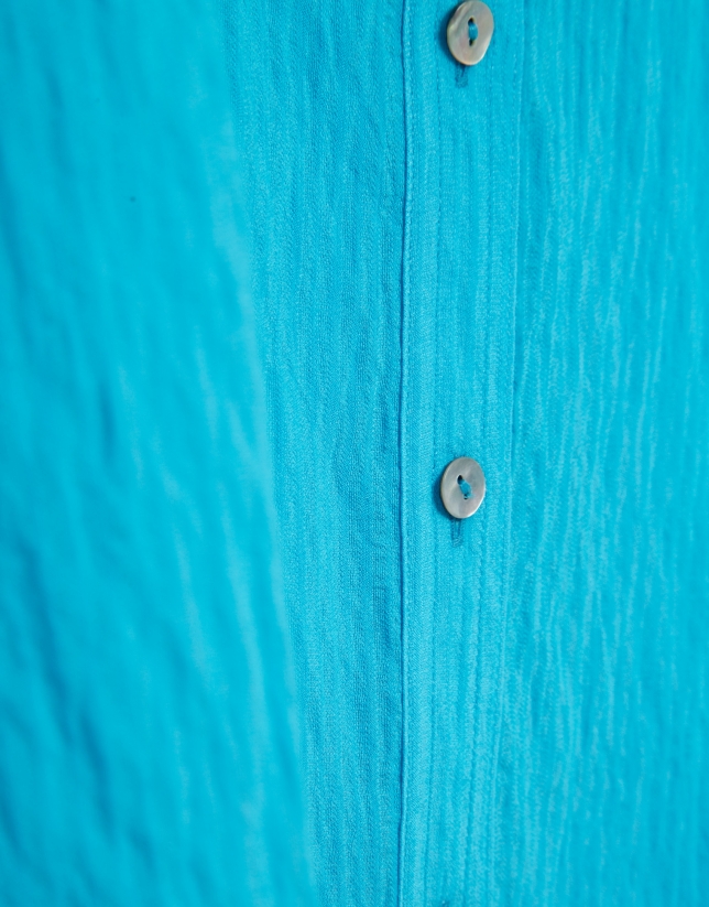 Blusa sin mangas y con bolsillos azul turquesa