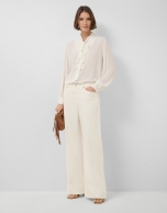 Ecru chiffon blouse with ruffles on the front