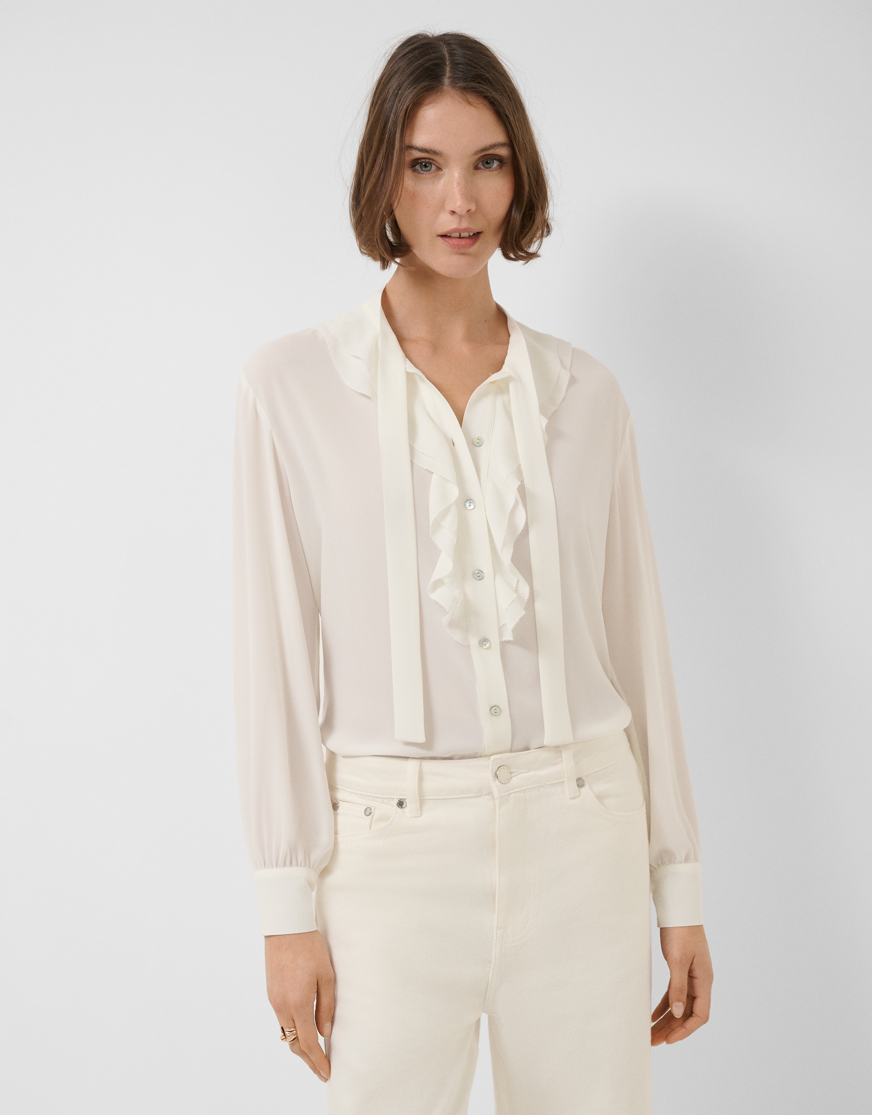 Ecru chiffon blouse with ruffles on the front