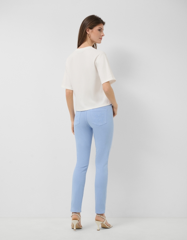 White oversized T-shirt with rhinestones on the chest