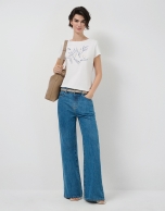 White short-sleeved t-shirt with floral embroidery on the front