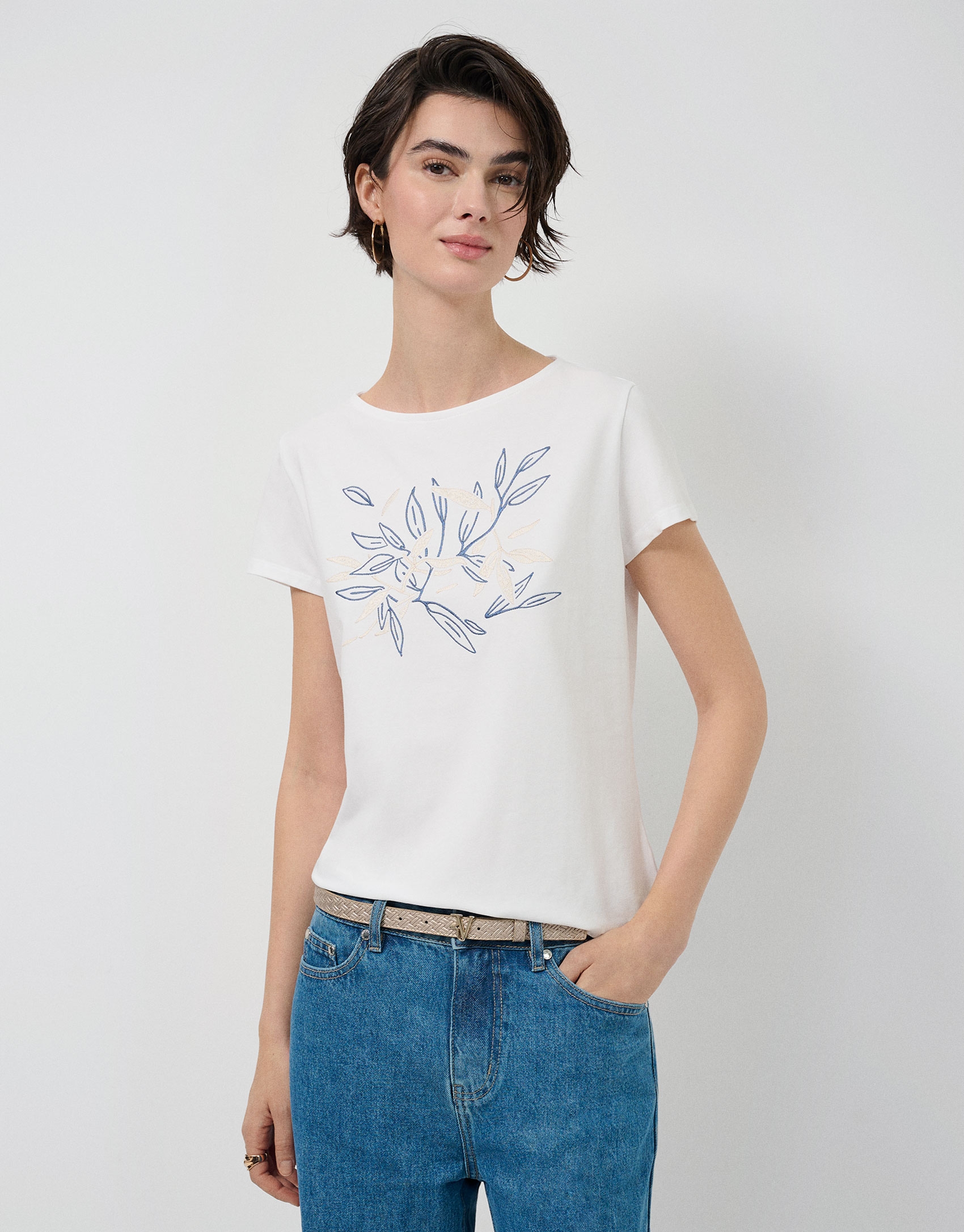 White short-sleeved t-shirt with floral embroidery on the front