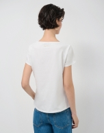White short-sleeved t-shirt with floral embroidery on the front