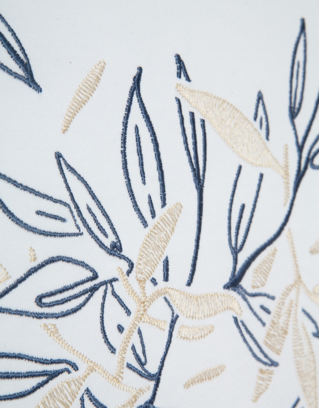 White short-sleeved t-shirt with floral embroidery on the front