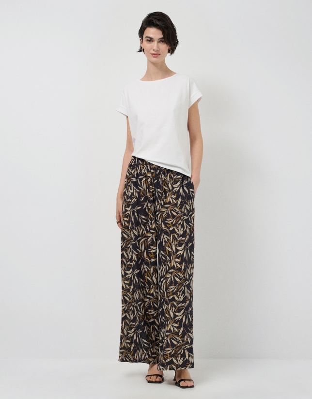 Oversized white sleeveless T-shirt with floral embroidery