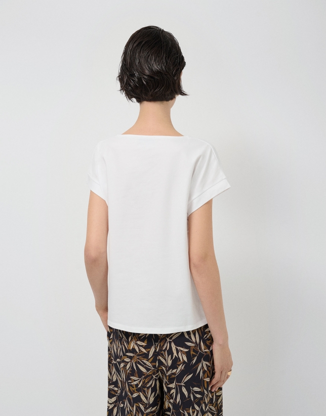 Oversized white sleeveless T-shirt with floral embroidery
