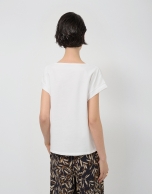 Oversized white sleeveless T-shirt with floral embroidery