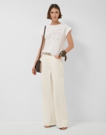 Oversized white sleeveless T-shirt with stars and leaves