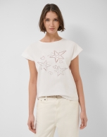 Camiseta sin mangas oversize blanca con estrellas y hojas