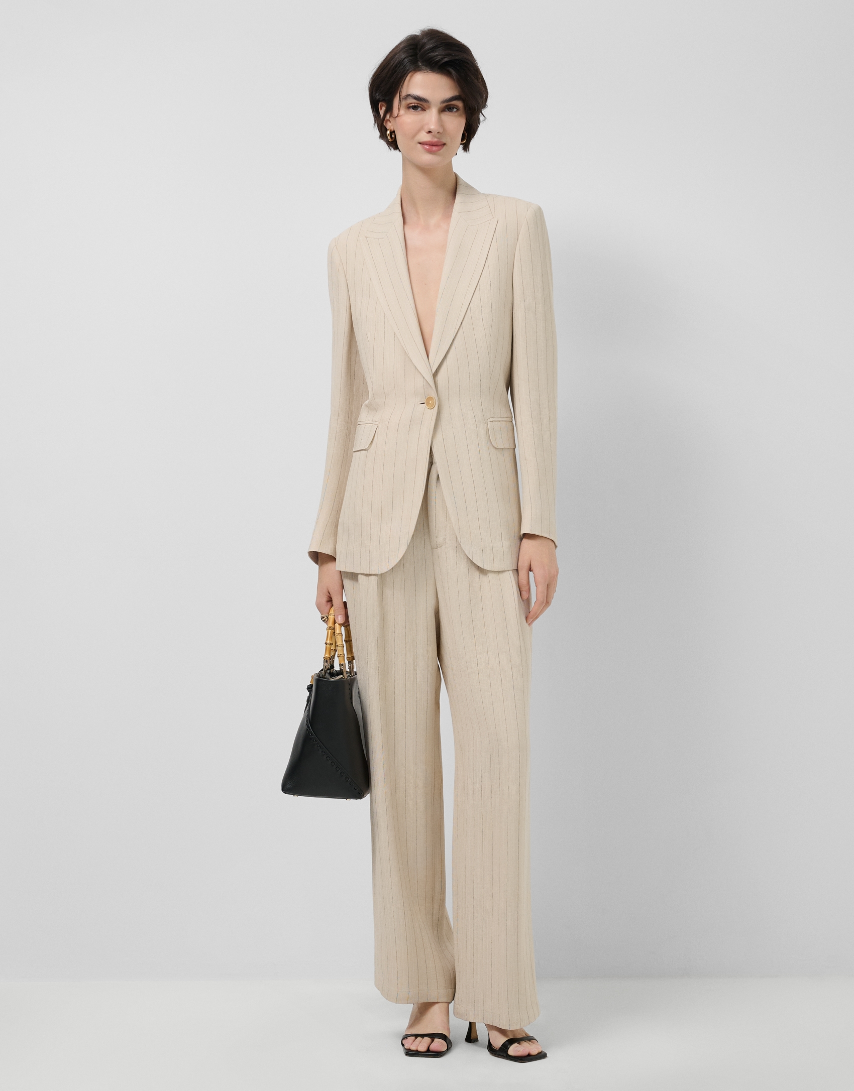 Beige single-button blazer with black pinstripe