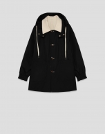 Reversible trench coat in camel/black