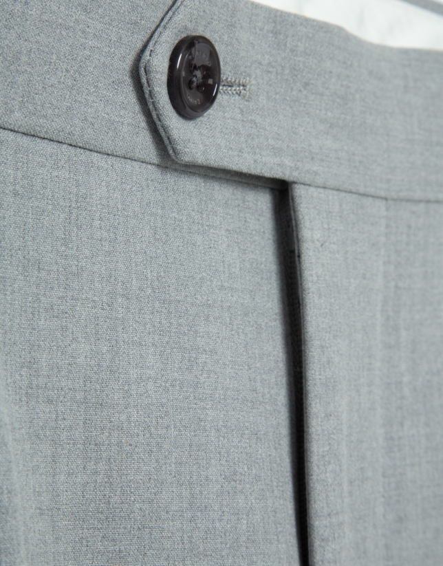 Grey melange trousers with buckles
