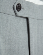 Grey melange trousers with buckles