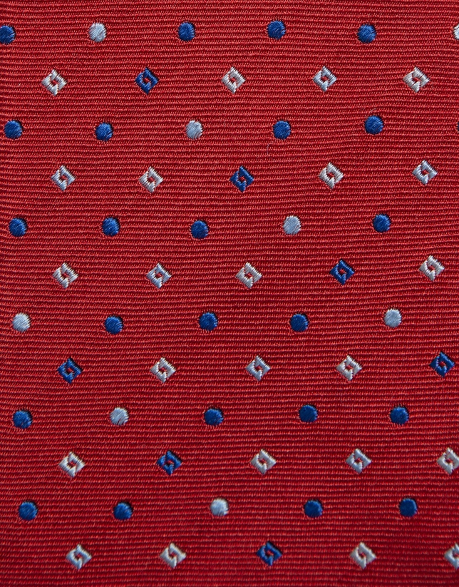Red silk tie with geometric jacquard pattern in shades of blue