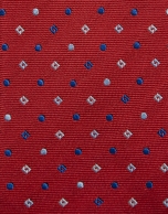 Red silk tie with geometric jacquard pattern in shades of blue