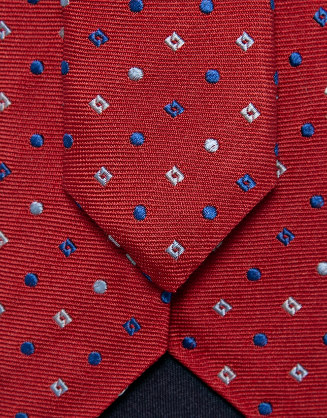 Red silk tie with geometric jacquard pattern in shades of blue