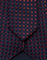 Navy silk tie with red geometric jacquard pattern