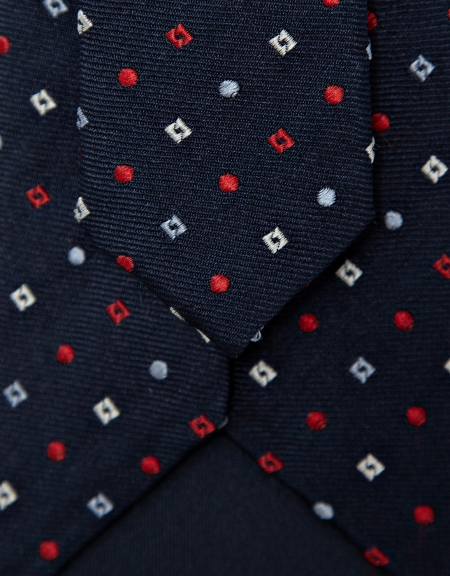 Navy silk tie with red/white geometric jacquard pattern