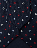 Navy silk tie with red/white geometric jacquard pattern