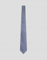 Light blue silk tie with navy geometric jacquard pattern