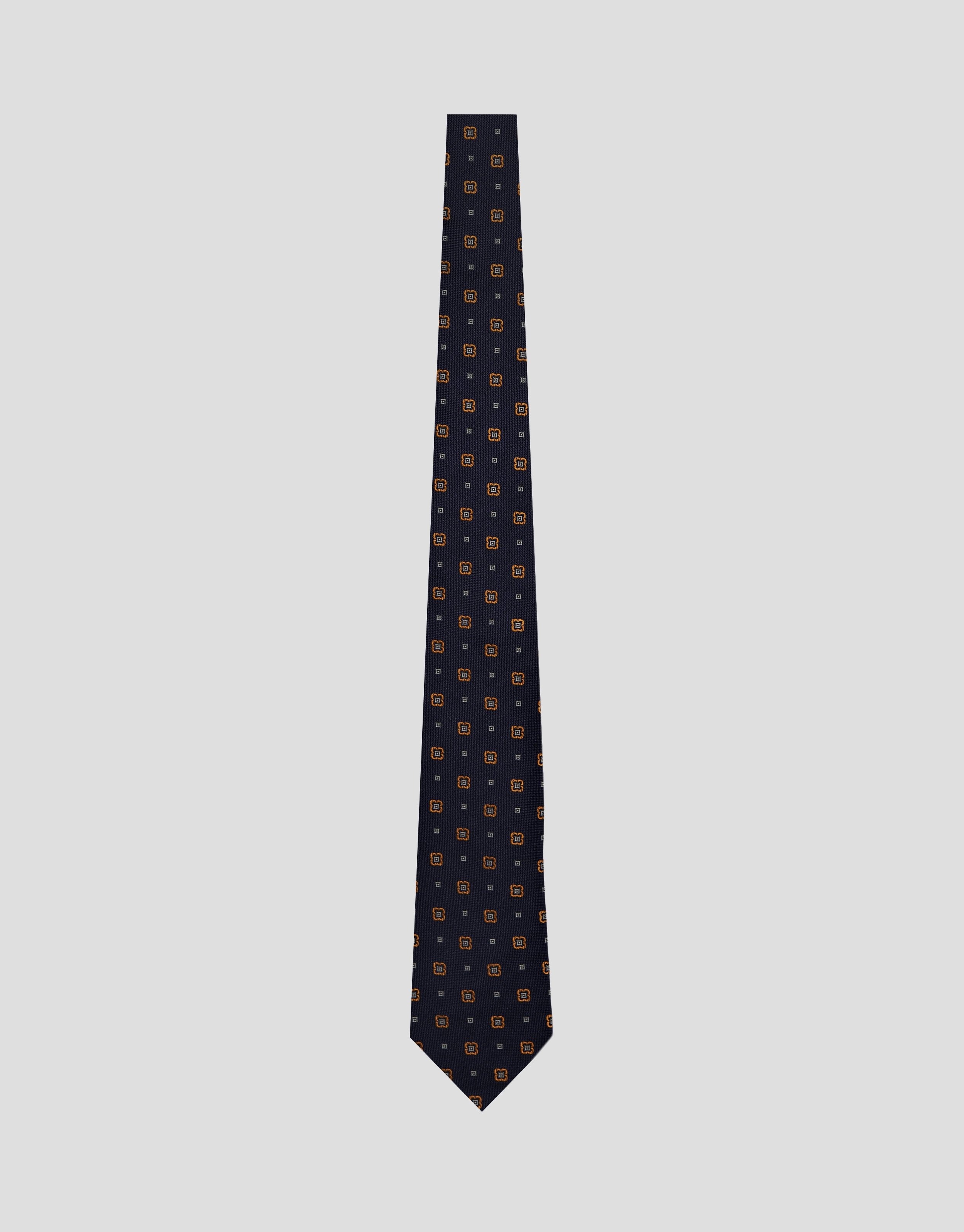 Navy silk tie with geometric orange flower jacquard pattern