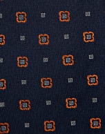 Navy silk tie with geometric orange flower jacquard pattern